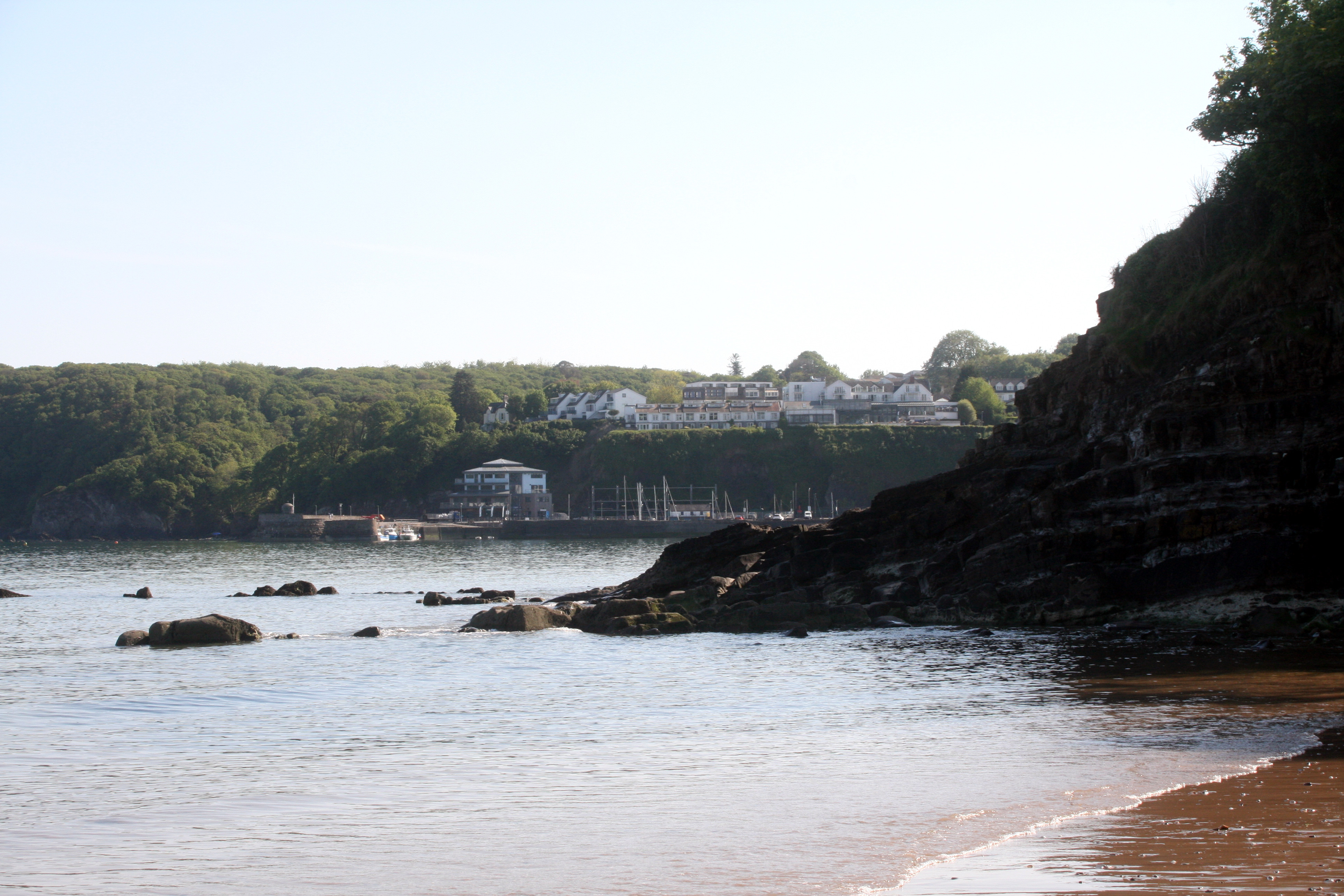 Calm ocean and golden beach in West Wales, background image for local web design studio